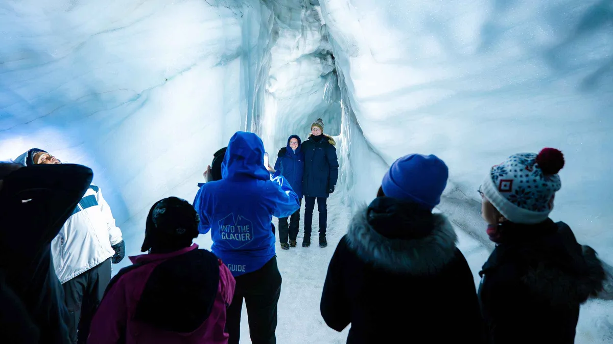 Lit corridor inside the man-made Langjökull ice tunnel, the year-round option on an Iceland ice cave day tour from Reykjavík