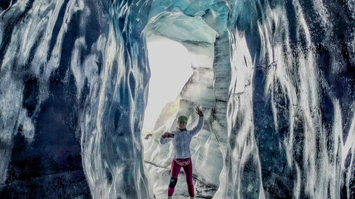 Ash-streaked blue ice inside the Katla cave under Mýrdalsjökull on a super jeep Iceland ice cave day tour from Vík